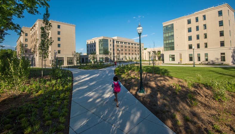 A student walking on East Campus