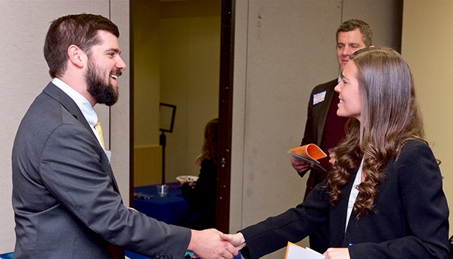 Student and alumnus meet at networking reception