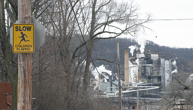 Children at play with smoke stacks