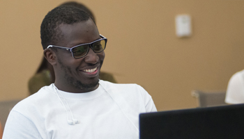 Student in front of his laptop